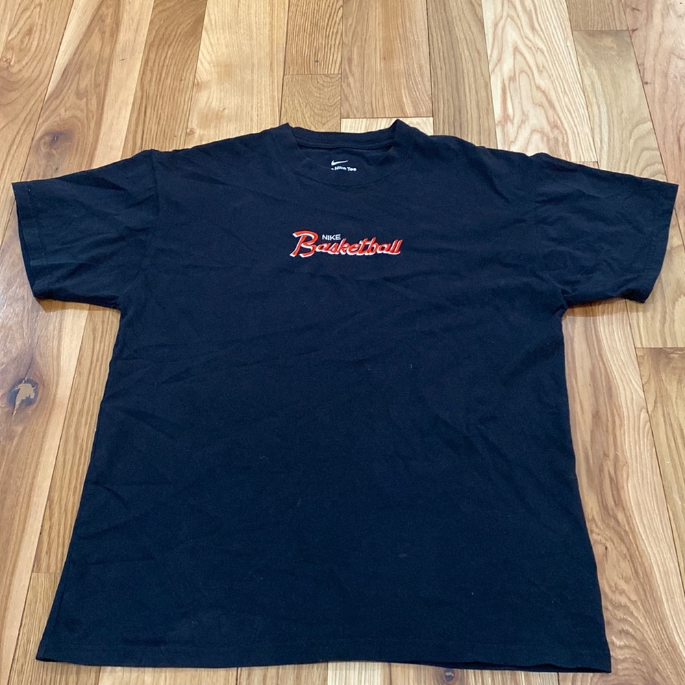 Black Nike basketball tshirt with red and white